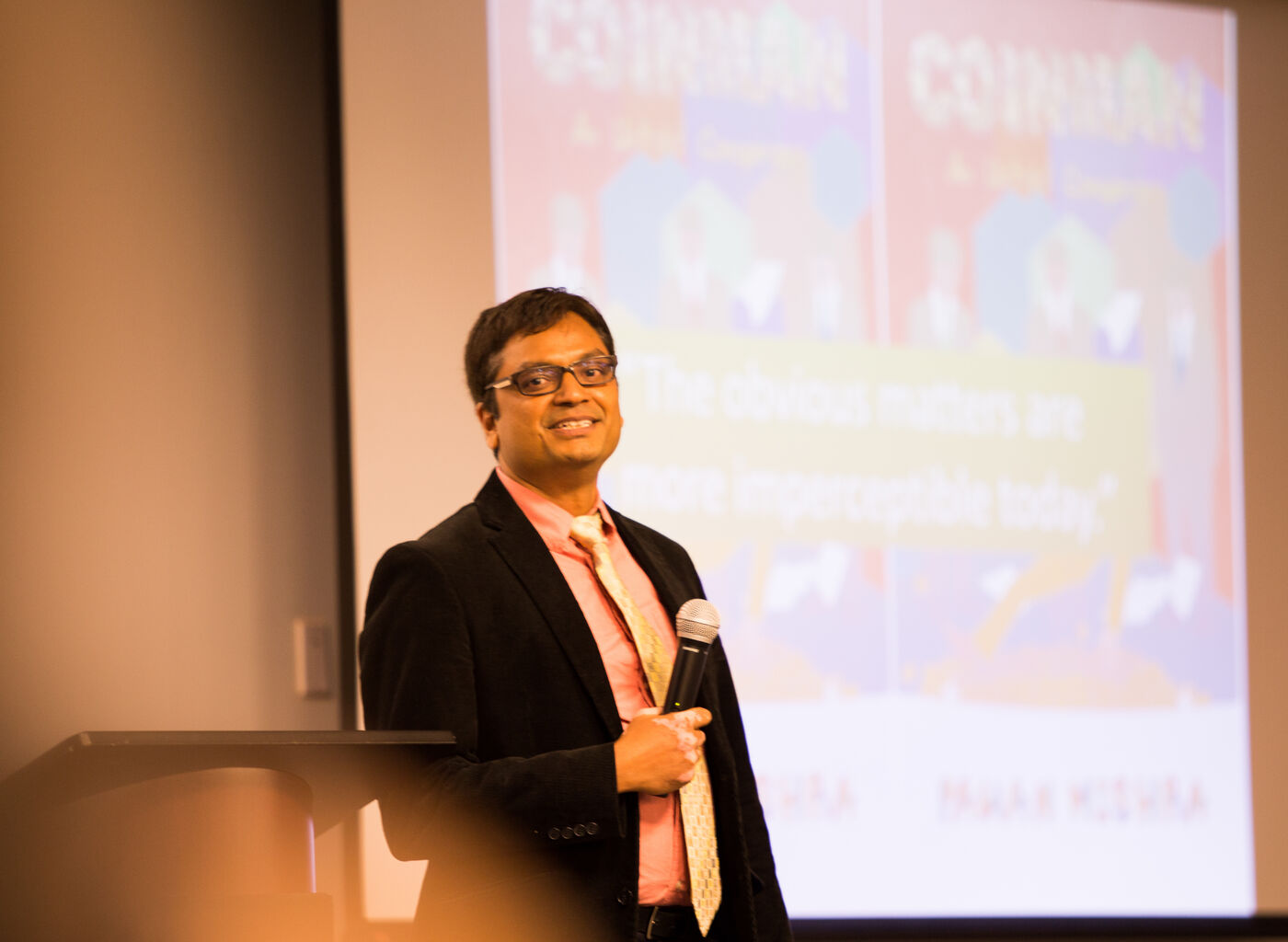 Pawan Mishra speaking at a Coinman book event
